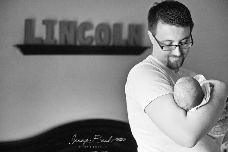 westerville ohio newborn photographer - black and white of dad holding baby