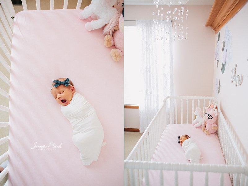 westerville ohio newborn photographer - newborn girl swaddled in white wrap laying in crib with pink sheet