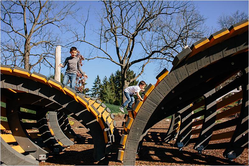 Westerville-ohio-commecial-photographer-earthscape-playground - johnston-mcvay park- kids playing on the butterfly play structure