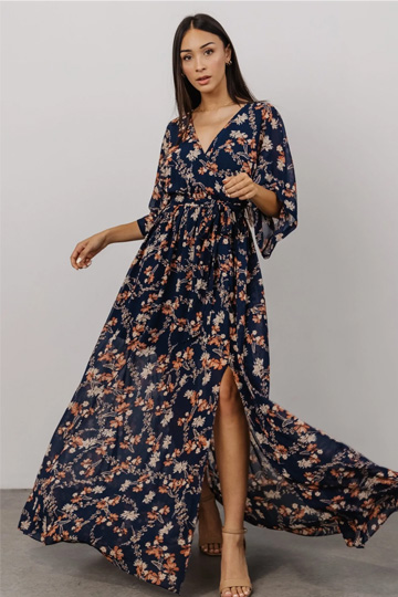 woman in navy floral dress