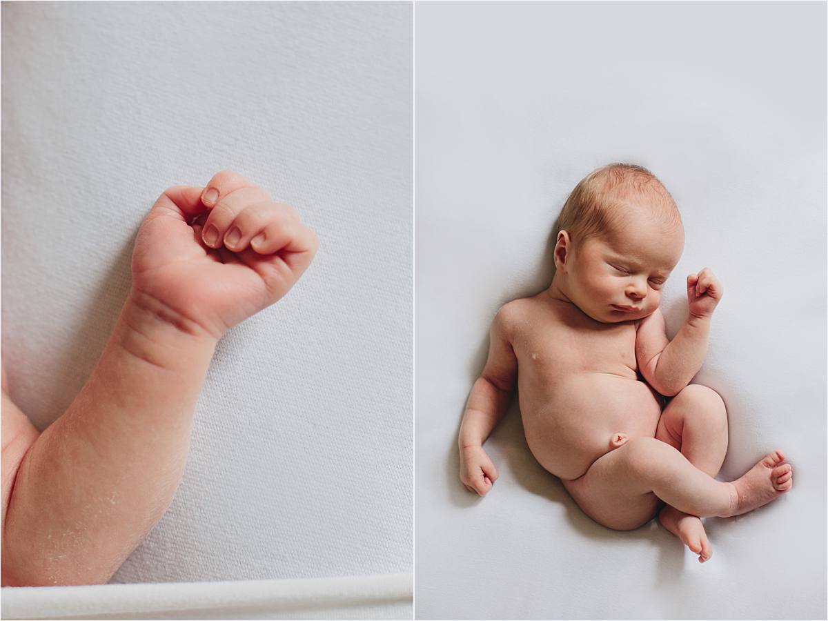 close up of baby hand and naked baby laying natural