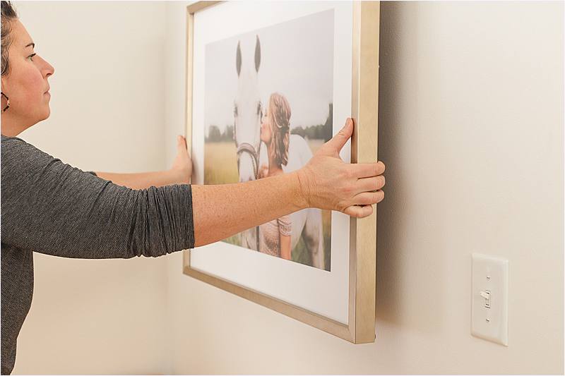 showing how to hang wall art without nails